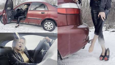 Anastasia does winter cranking, then warms her feet in exhaust fumes