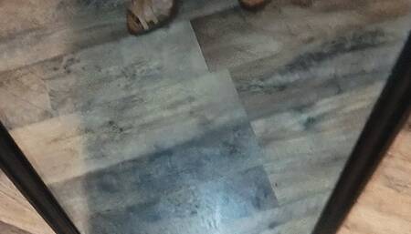 Tempest in tan leather wedges flexing calves in mirror