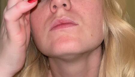 Stifles and loud sneezes with a honking nose blow