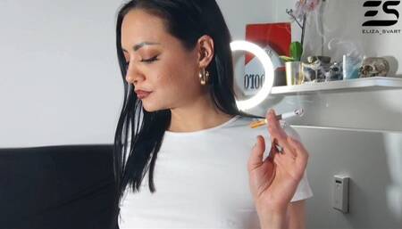 Smoking in a white tshirt and no bra