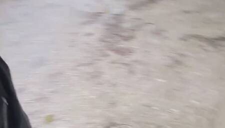 High heel leather boots in puddles