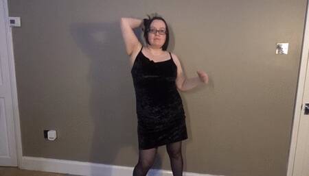 Striptease in black dress holdup stockings high heels