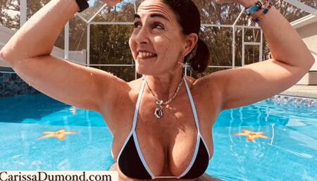 Carissa in the black and white bikini with microfoam gag underwater in the pool