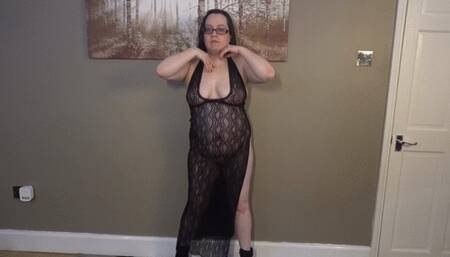 Dancing in striptease in long black lace night dress