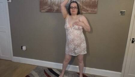 Striptease in White lace lingerie and high heel ankle boots strip naked