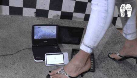 Electronic devices crushed under heeled Flip Flops