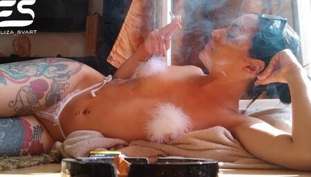 Smoking while tanning in a string and nipple covers