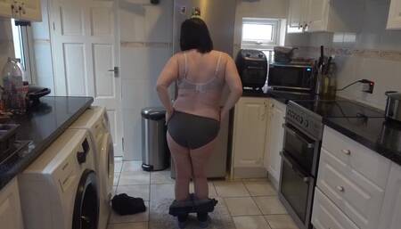 In the Kitchen Undressing in Jeans and Black Top