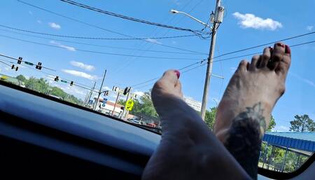 Bare Feet on Dashboard in Moving Car