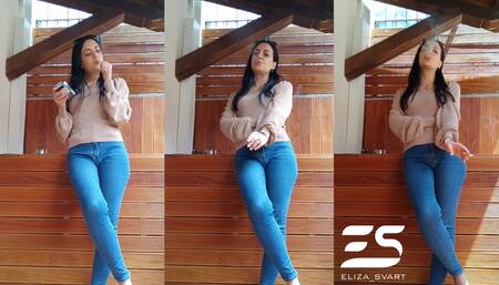 Smoking a cigarette in denim jeans after breakfast