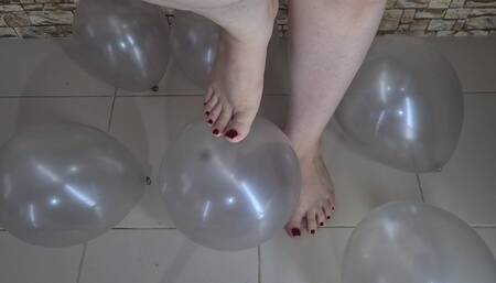 Big feet popping balloons