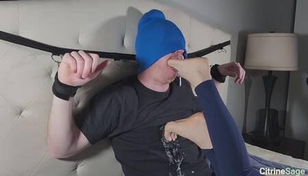Foot slave bound to head board gags deeply on my feet