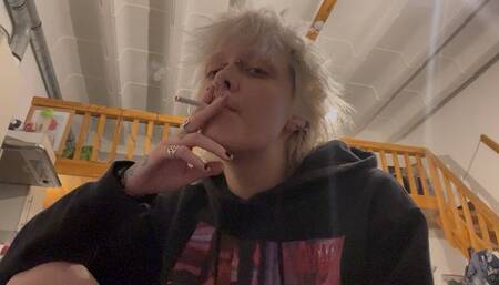 goth girl no makeup smoking a cigarette in silence