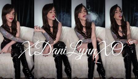Smoking Wearing Black Lingerie and PVC Boots