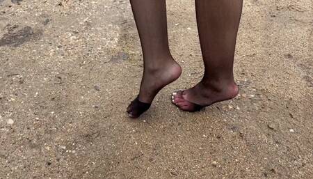 Girl in nylon stockings walk on muddy slippery road, she crushing her stockings, make them dirty, ripped and untidy