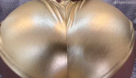 A FARTING STRIPPER IN GOLD BUM SHORTS