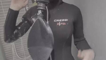 shower in gasmask and scuba wetsuit