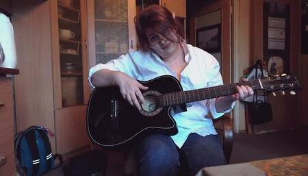 Lola plays guitar