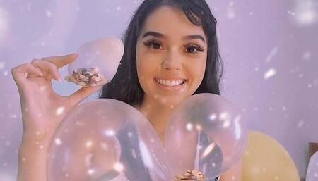 baloes com confetes na cabeça