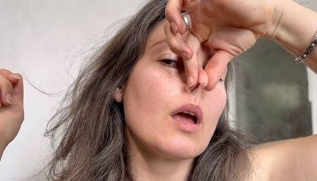 she is playing with her nose m0