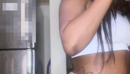 Ebony goddess coughing while eating super spicy Thai food in the kitchen with a thong one and white tshirt