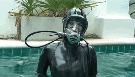 Sexy rubber girl in black latex catsuit and scuba gear - Swimming and diving in pool outdoor