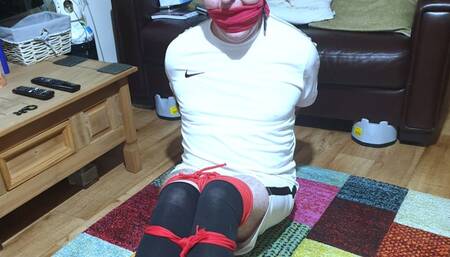 Footballer bound and gagged escape challenge in red rope 1