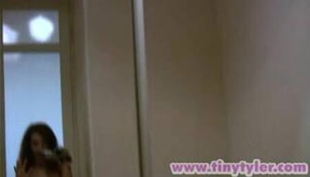 Tiny Tyler teases her clit in solo scene