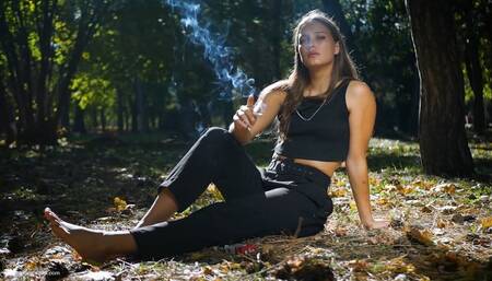 Smoking two reds in the park barefoot