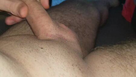 Masturbating my little cock until it cums.