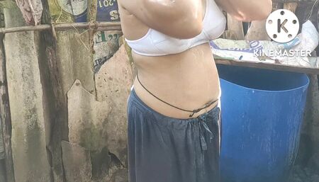 Indian house wife bathing outside beautiful