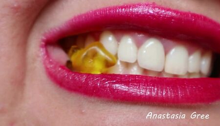 Destruction of gummy bears is extremely close up